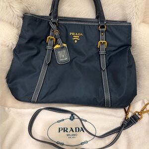Prada navy blue tessuto bag with original shoulder strap; gold accents, dust bag